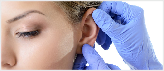 Woman Having Ear Cosmetic Surgery